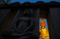 Buddha statue wearing a face mask