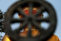 Buddha statue wearing a face mask