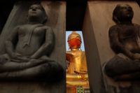 Buddha statue wearing a face mask